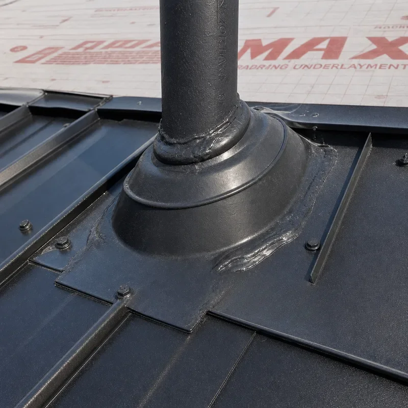 Sealed pipe boot flashing integrated with metal roof panels and underlayment